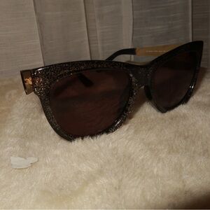 Gucci Black and Gold Sunglasses with Sleek Design